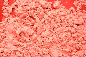 Children's kinetic sand pink color for sculpting figures. Surface texture
