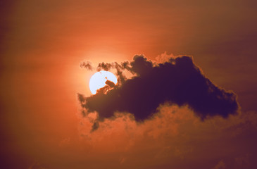Bright yellow sunrise sunset with big sun and clouds