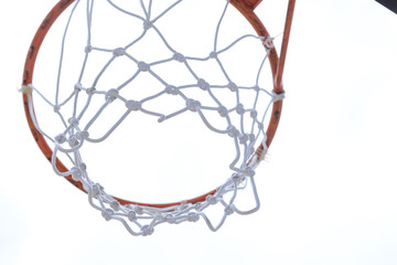 Under basketball hoop outdoors at cloudy day. Sport concept