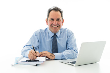 Attractive happy mature caucasian businessman working on laptop computer feeling successful at work