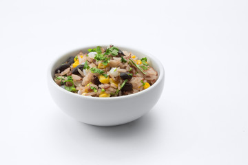 close up view of  bawl with fresh rice and beans on white back