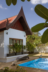 View of nice Bali style summer bunglaow in summer tropic environment 