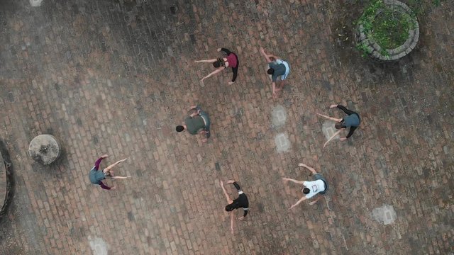 People training yoga, aerial view