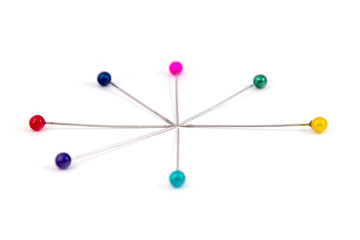 coloured sewing pins on a white background isolated