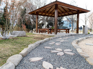 Wooden bench in indoor park in the Flora public garden in