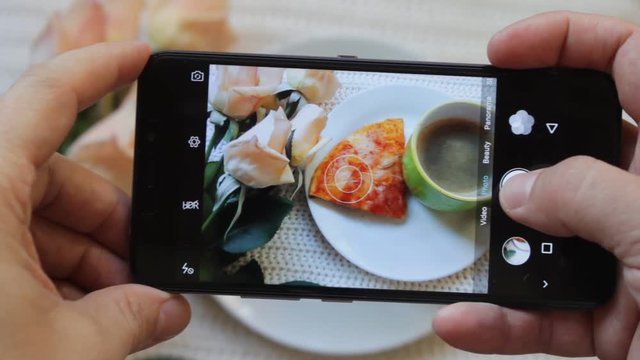 Closeup Male Hand Taking Pictures Of Food With Smartphone In Cafe