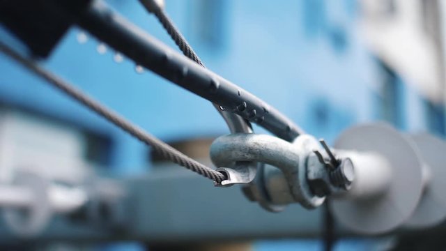 Connection with a steel cable. Frame. Close-up of metal parts