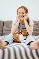 Cute young woman with her small dog