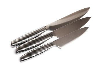 Set of steel kitchen knives on white background