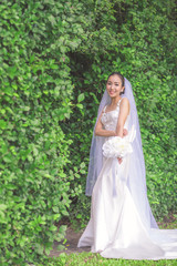 Obraz na płótnie Canvas Wedding concept. Beautiful bride with bouquet