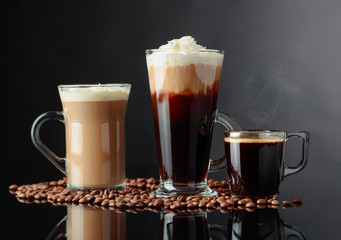 Various coffee drinks on a black background.