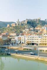 Naklejka premium Dawn in the old city of Tbilisi, Georgia. Panoramas of the ancient city and the fortress.