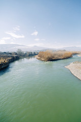 Rivers and mountains on beautiful views in Gori. Nature of Georgia on the panorama.