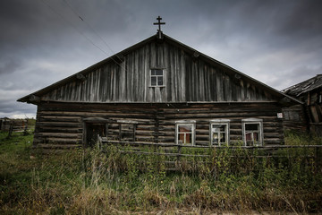 front view of wooden house in russian village in sunny summer day
