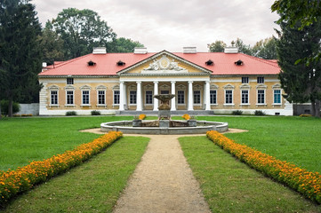 View of the estate in a classic style on a cloudy day.