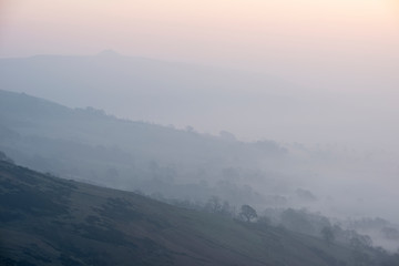 Stunning Winter sunrise landscape image of The Great Ridge in the Peak District in England with a...