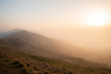 Stunning Winter sunrise landscape image of The Great Ridge in the Peak District in England with a...