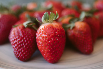 Strawberries background. Close up view of fresh and juicy strawberries as background. 