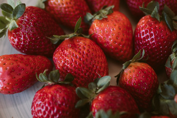 Strawberries background. Close up view of fresh and juicy strawberries as background. 