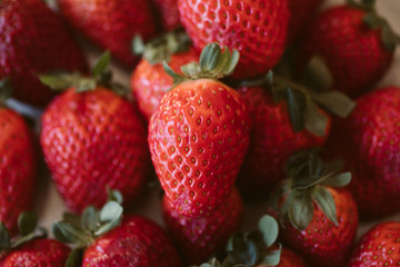 Strawberries background. Close up view of fresh and juicy strawberries as background. 
