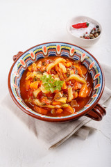 Stewed vegetables. Vegetable ragout of sweet pepper, carrot, onion, tomatoes. Vegetarian food.