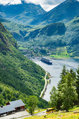 Fjord Geirangerfjord with ferry boat, Norway.