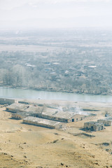 Fields and natural farms in the vastness of Georgia. Pastures and hayfields in the mountains.