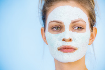 Girl with dry white mud mask on face