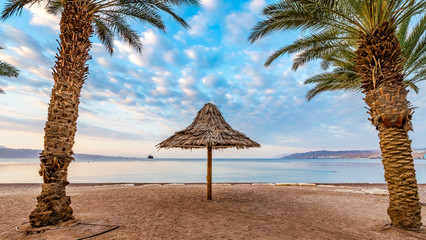 Morning at a public beach of Eilat - famous tourist resort and recreational city in Israel and Middle East