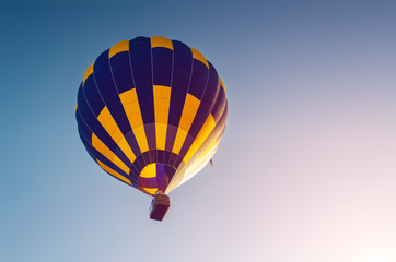 Colorful hot air balloon flying in the blue sky