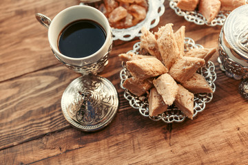 Turkish sweets with coffee on a wooden table