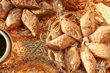 Turkish sweets with coffee on a wooden table