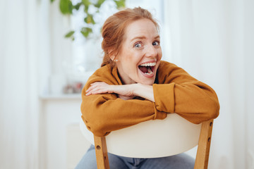 Excited young woman with her mouth agape