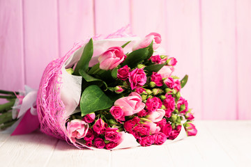 background beautiful bouquet of pink wild rose and pink tulip