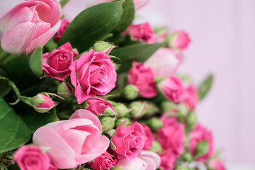 background beautiful bouquet of pink wild rose and pink tulip