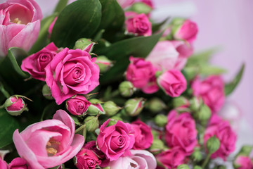 background beautiful bouquet of pink wild rose and pink tulip