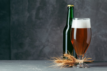 Single beer glass close up on dark stone background