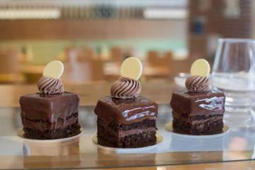 Selection of desserts, in a restaurant setting, with blurred background