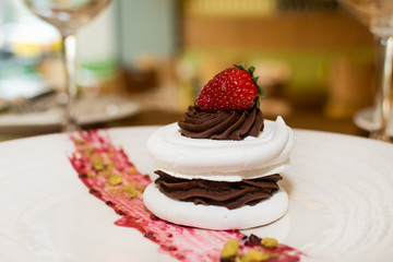 Selection of desserts, in a restaurant setting, with blurred background