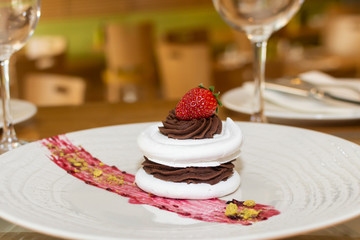 Selection of desserts, in a restaurant setting, with blurred background
