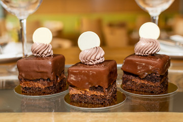 Selection of desserts, in a restaurant setting, with blurred background