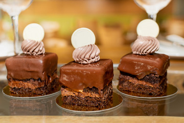 Selection of desserts, in a restaurant setting, with blurred background