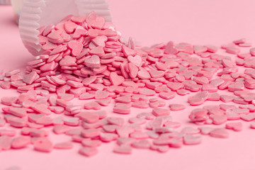 Sugar sprinkles  food background on pink cardboard