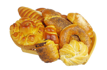 Baked goods in a basket on a white background. Isolated on white
