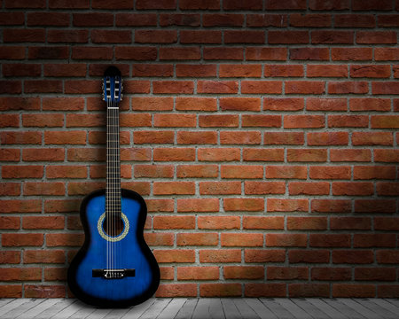 acoustic guitar brick background wall shadow © YB