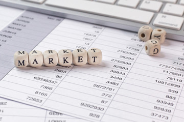 Fototapeta premium The market word on wood cube business content image.