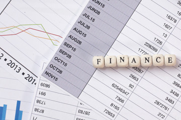 The finance word on wood cube business content image.