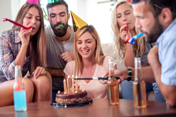 Friends with cake and candles