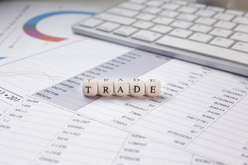 The Trade word on wood cube business content image.