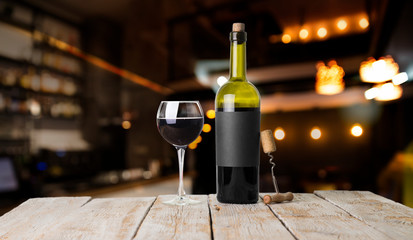 Expensive wine bottles collection and wooden barrel in the cellar, wine tasting and production...